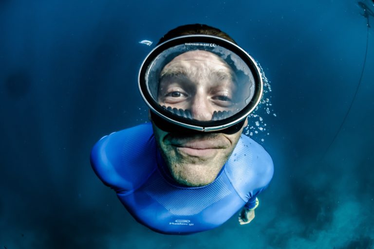 snorkeling man looking at the camera