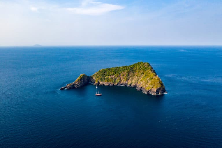 Koh Bon Island in The Similians - Thailand. The boat is The Junk liveaboard