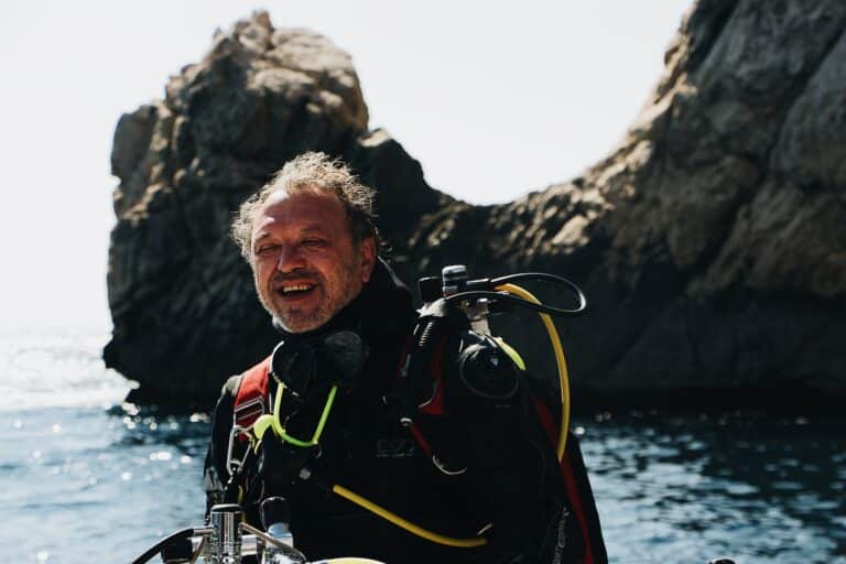 Older man contemplating if there is a maximum age for scuba diving