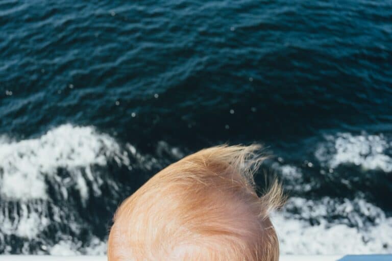 a baby looking out onto the ocean. Find out the best boy names that mean ocean here.