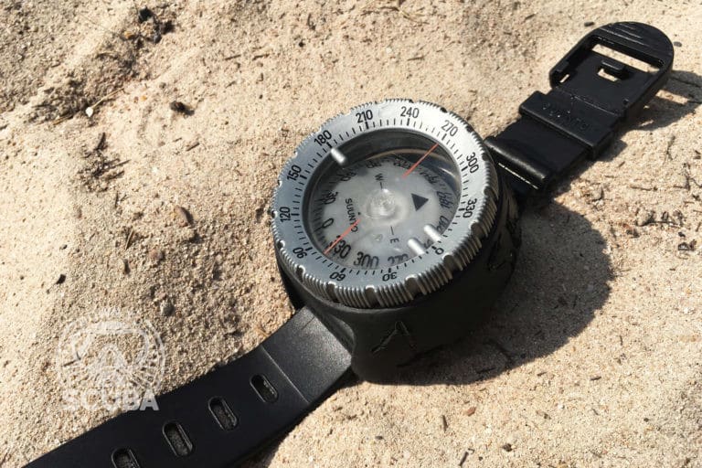 How To Navigate with a Compass Underwater when you are scuba diving. A photo of a standard diving compass.