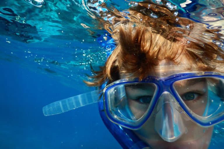 Boy enjoying his snorkel trip. What Do You Need To Go Snorkeling?