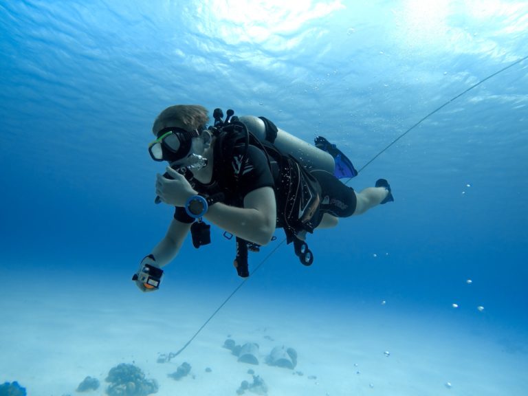 A scuba diver underwater. Learning the no mask breathing skill is important.